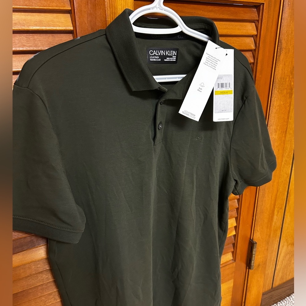 Calvin Klein Liquid Touch men’s Polo. Size Med. Brand new with tags. Plus more.